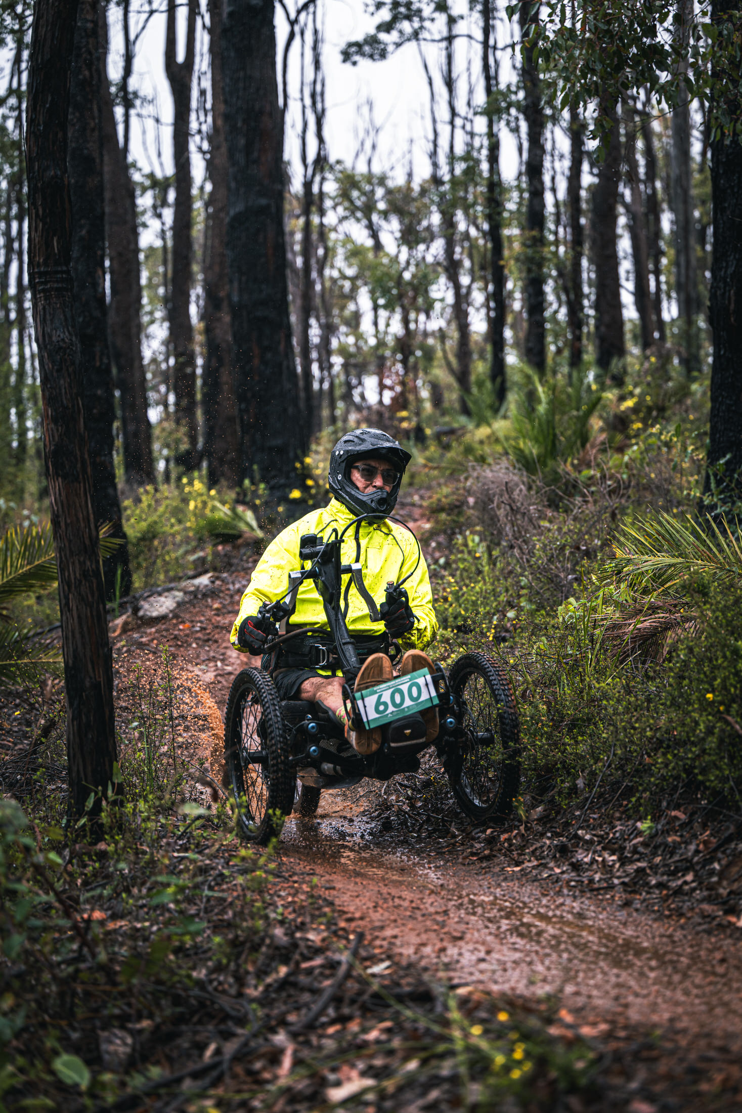 An adaptive mountain biker races at the AusCycling Enduro National Championships in Collie, WA