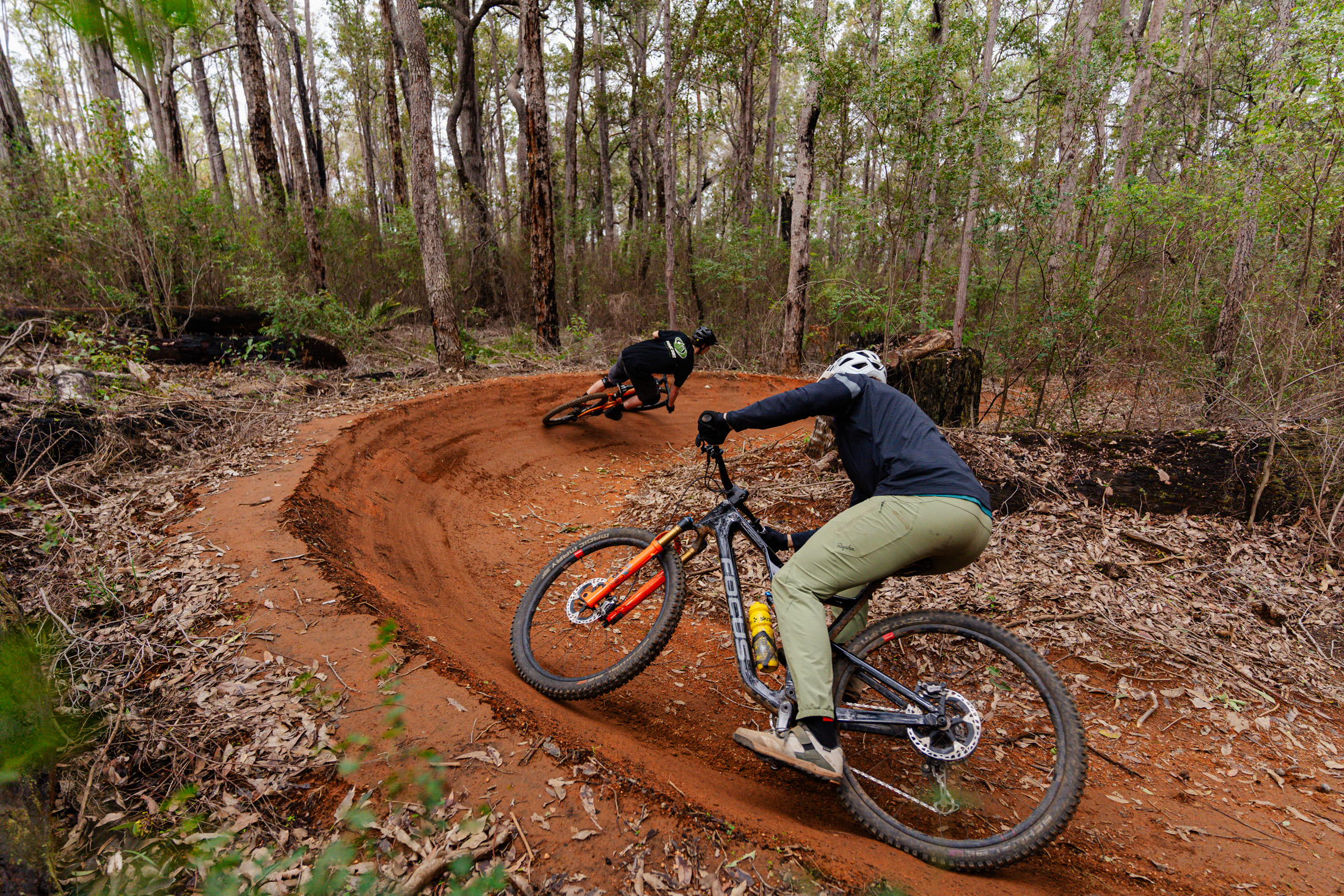Two riders rip around a bermed corner in Collie, WA